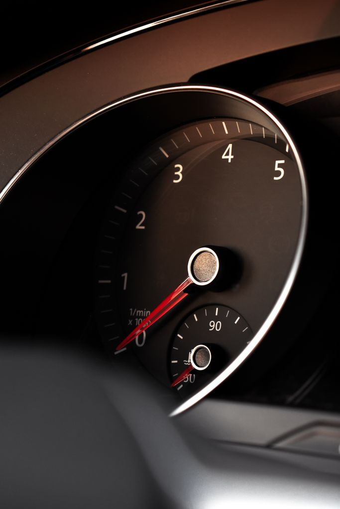 Detailed view of a car tachometer showing speed and RPM indicators.